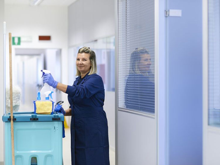 Woman with cleaning supplies